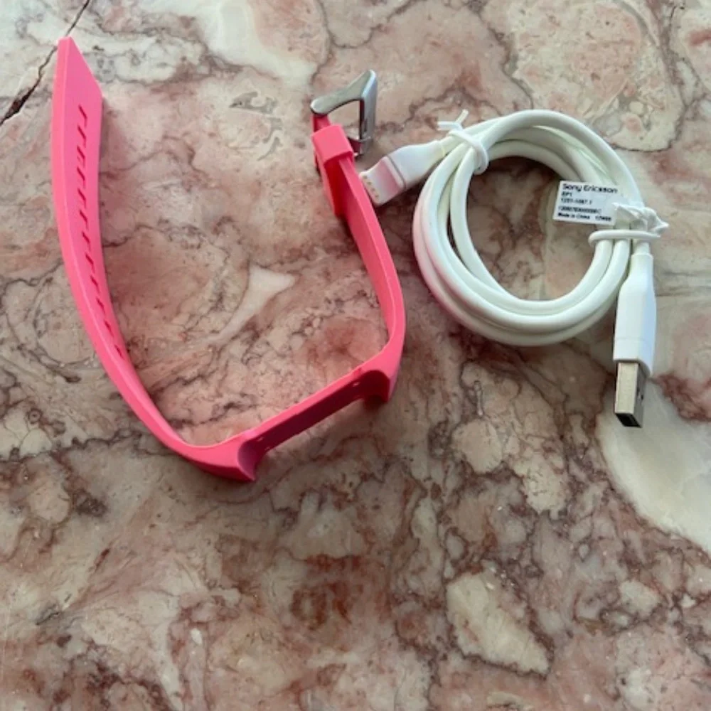 First generation Sony watch band in pink and power cord only *no watch* NEW